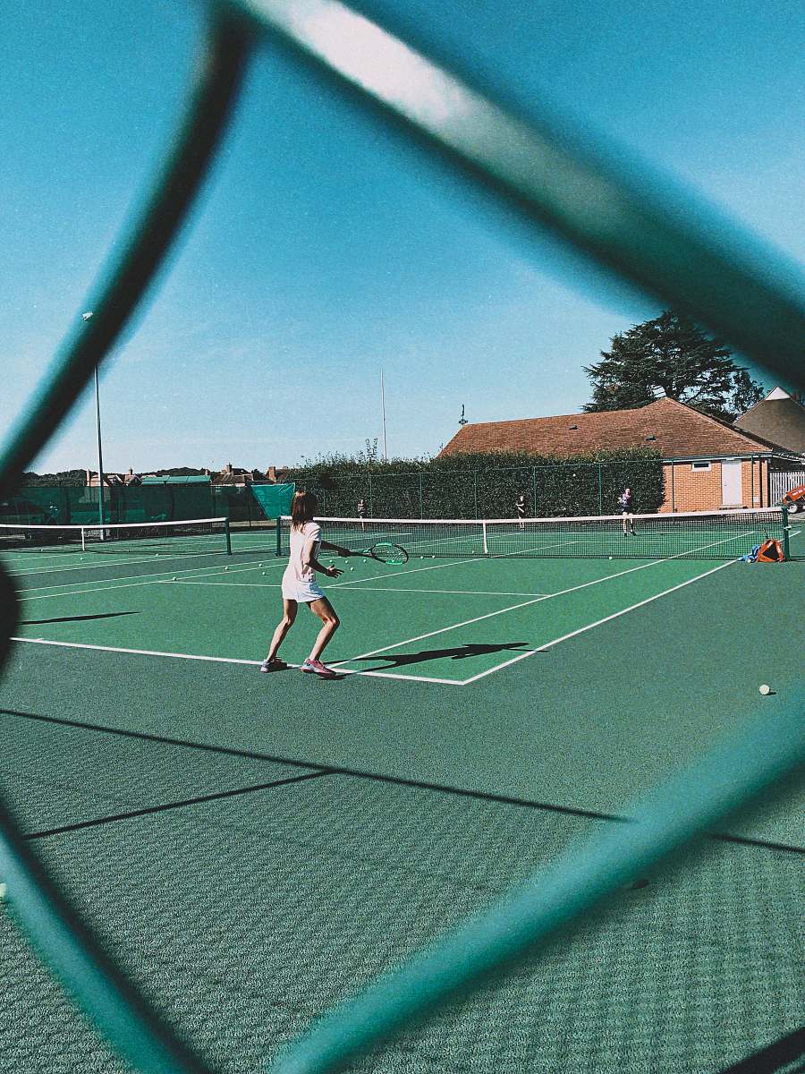 human woman playing tennis on court tennis court