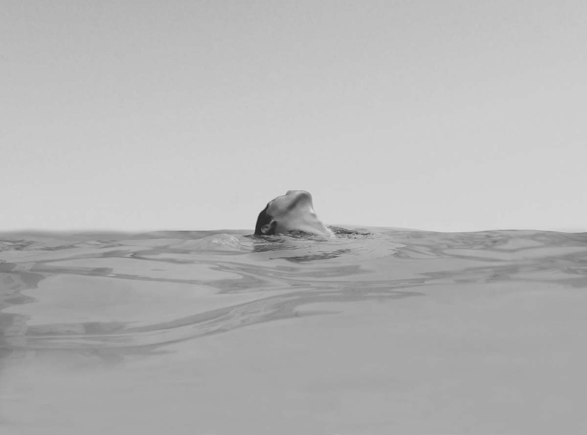 swimming woman swimming on the ocean photography black-and-white