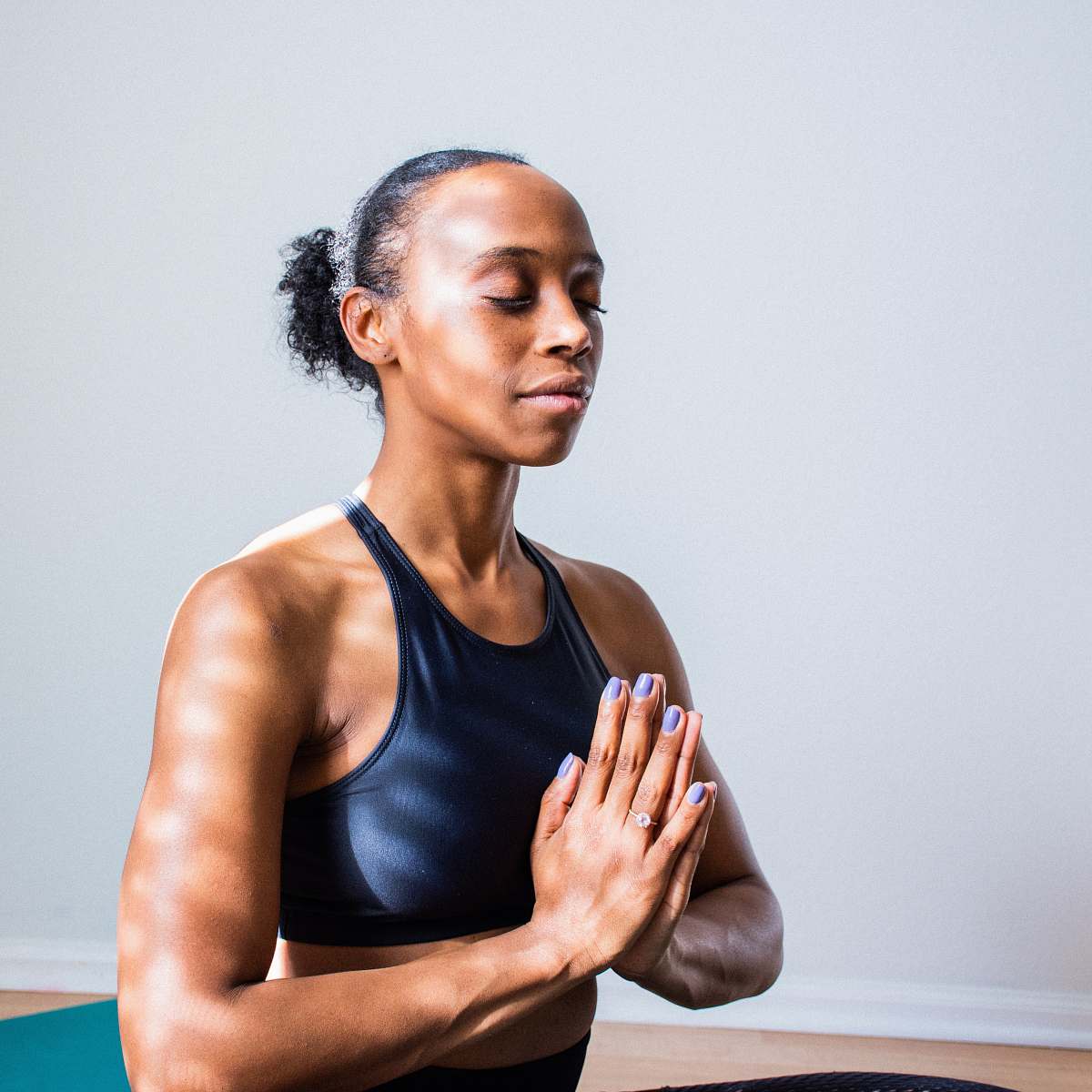 yoga woman wearing black sports bra fitness