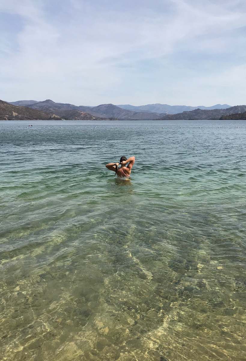 swimming landscape photo of a man on the beach human