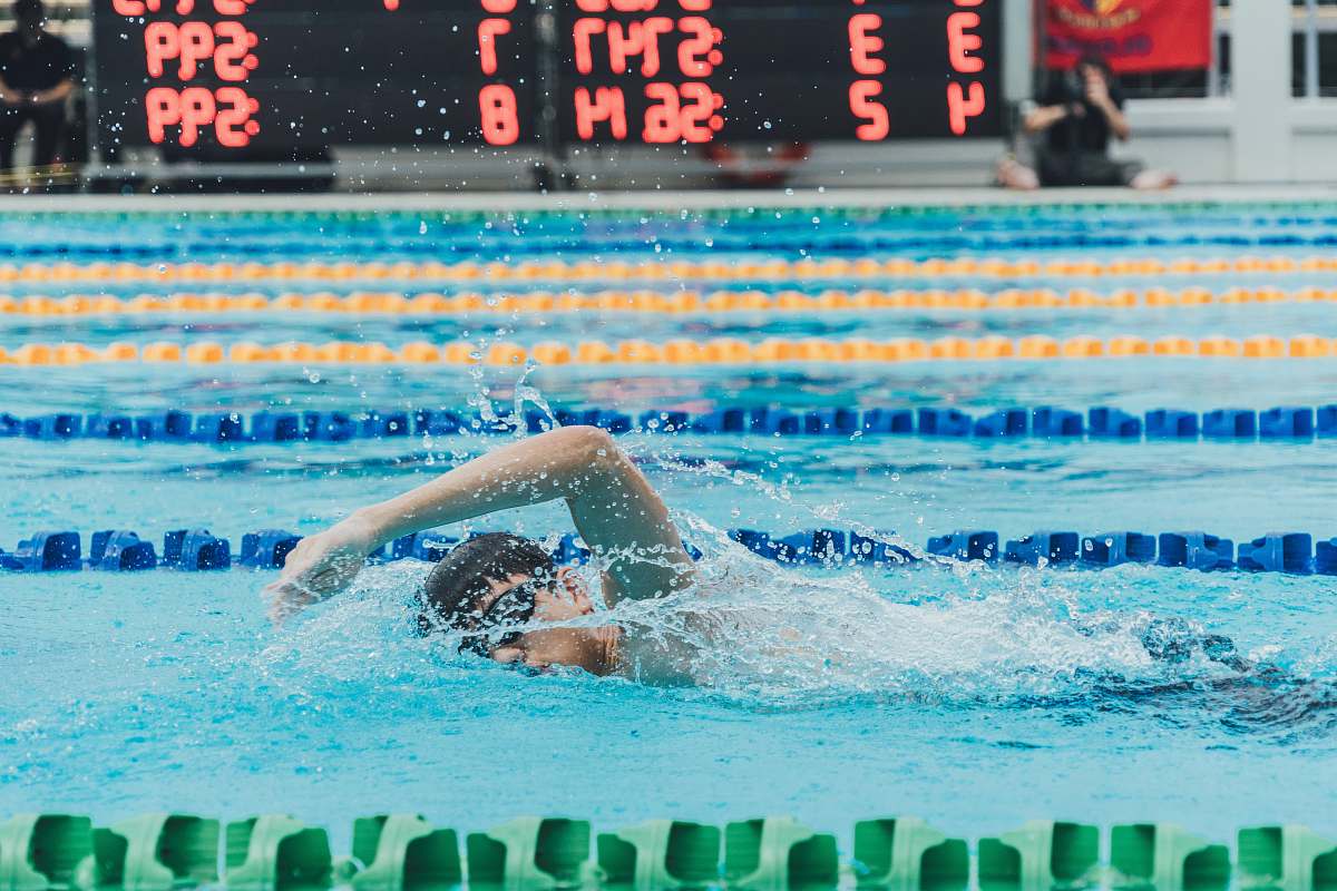 sport man swimming in body of water sports