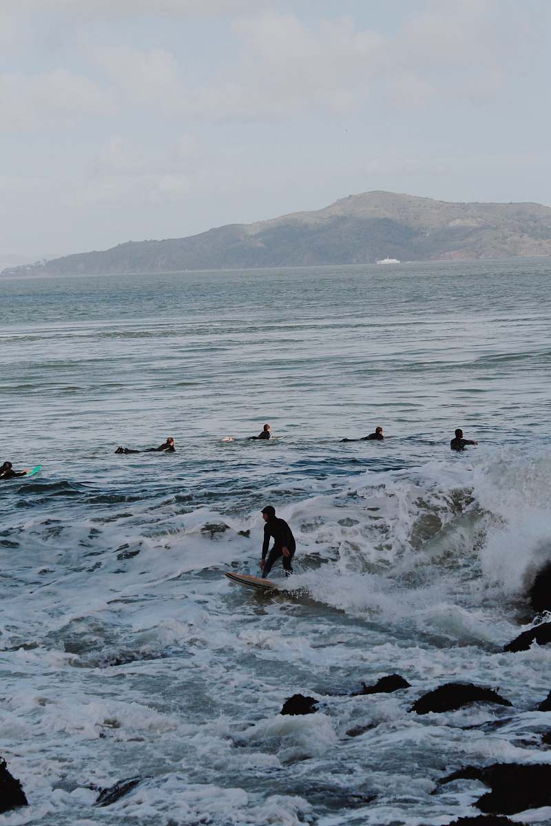 human people in ocean during daytime person