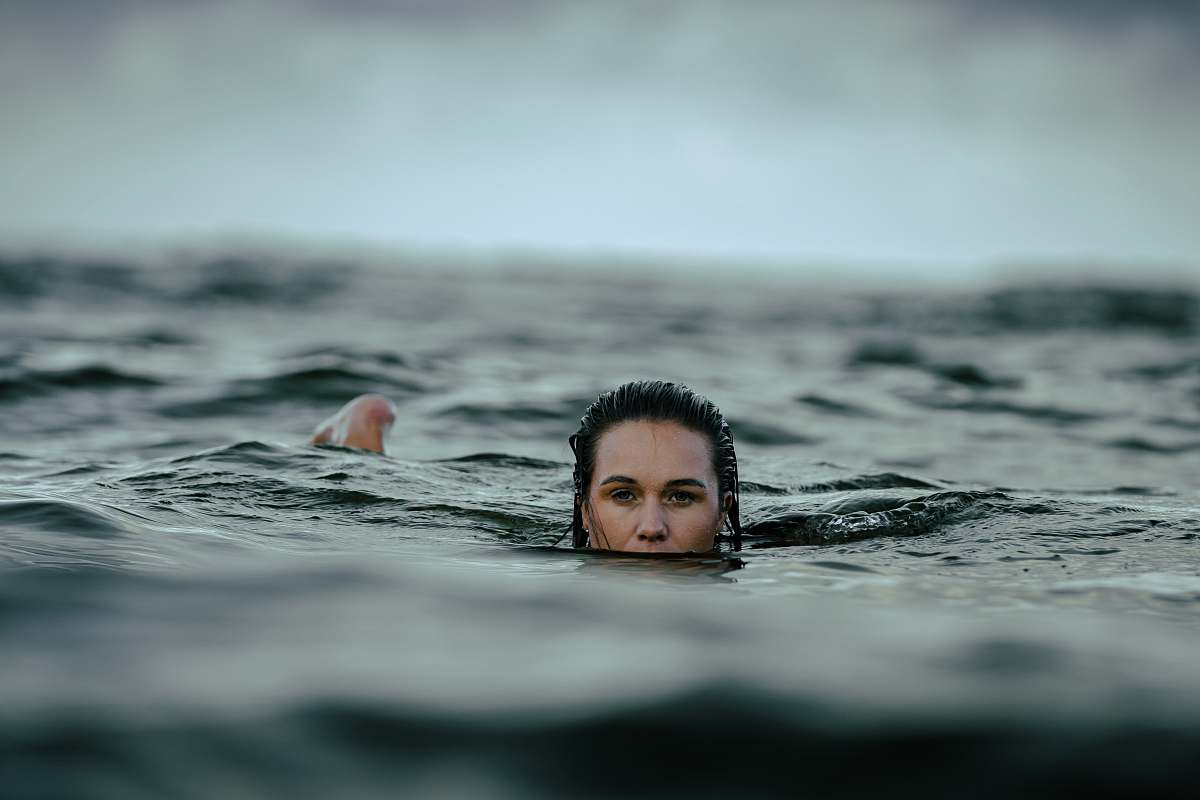 swimming woman dipping in ocean human