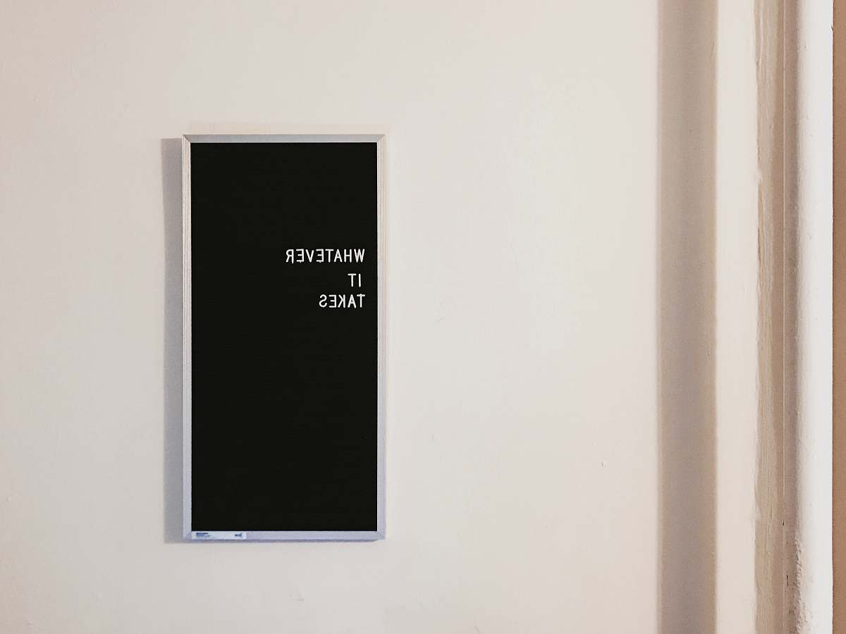 sign gray metal framed chalkboard with whatever it takes written typography