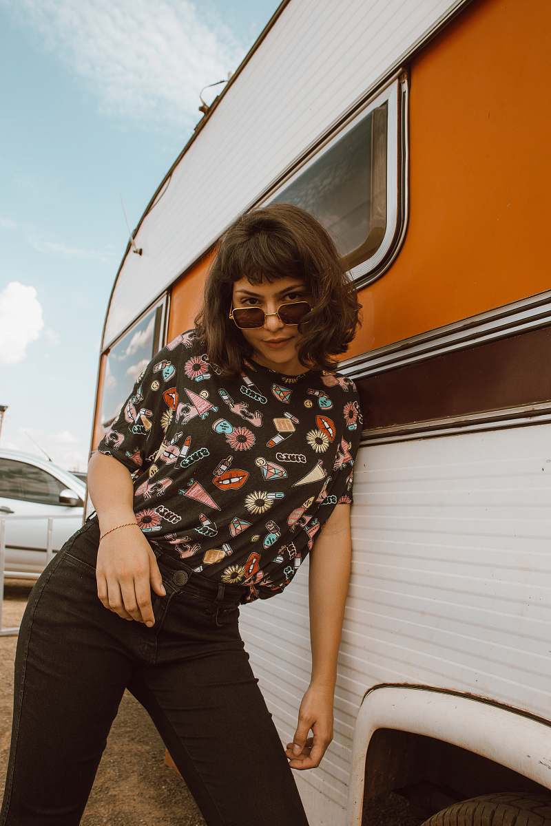 person woman leaning on white vehicle during daytime people