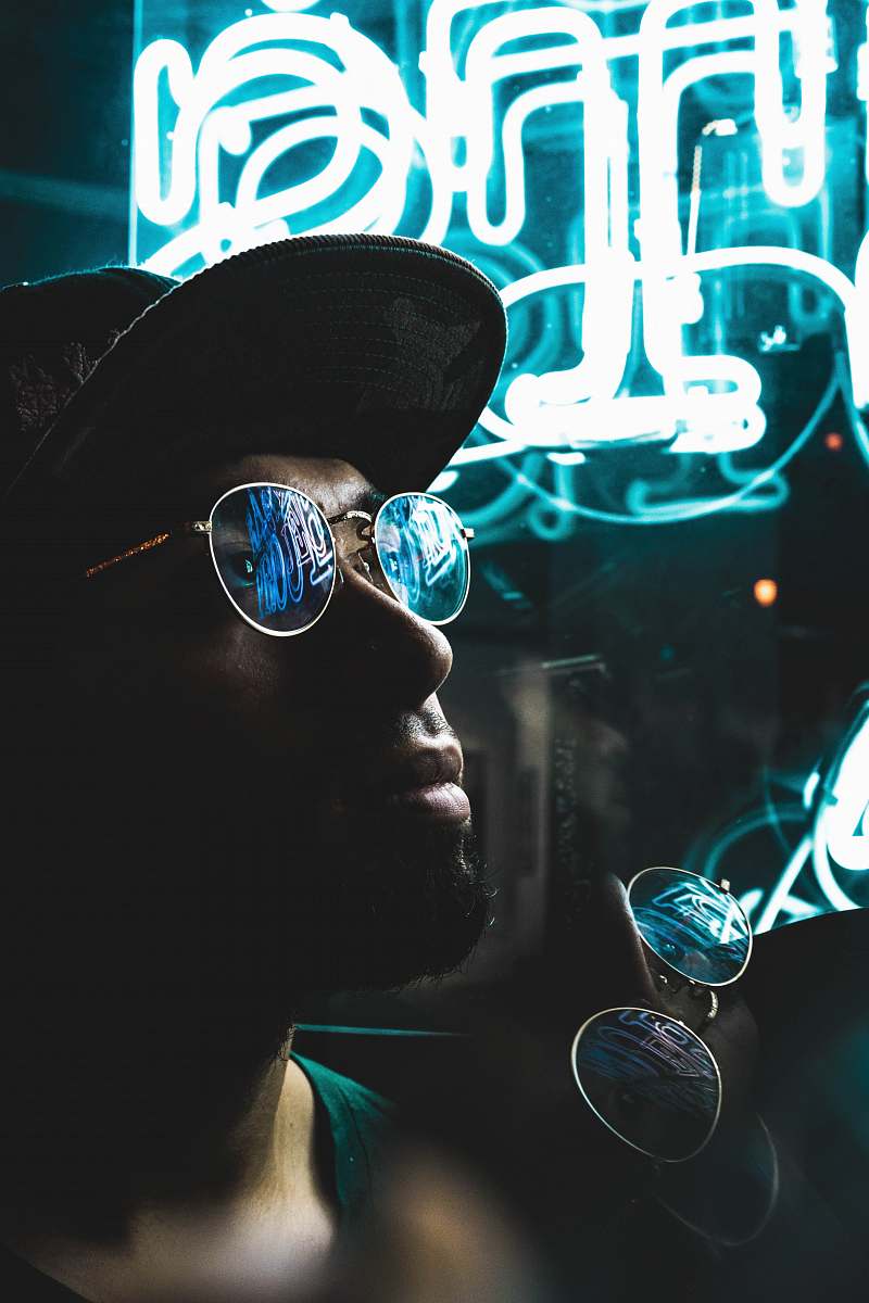 portrait man wearing sunglasses with silver-colored frames glasses