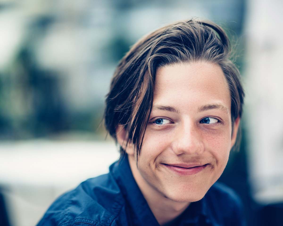 person man wearing collared shirt in closeup photography human