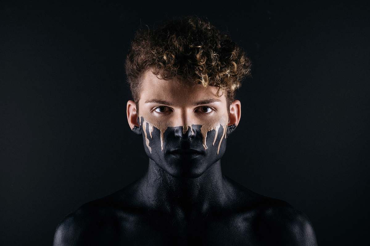 portrait man with black body paint human