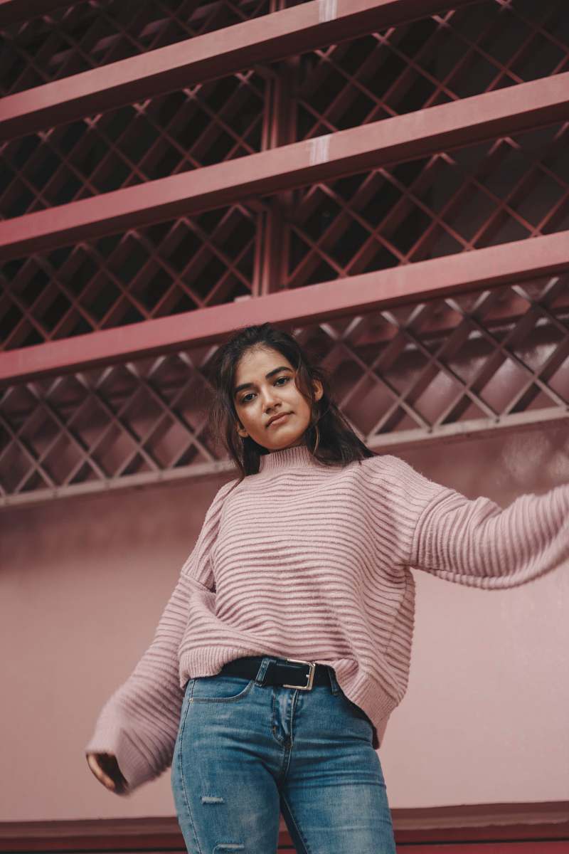 portrait photo of woman standing beside wall human