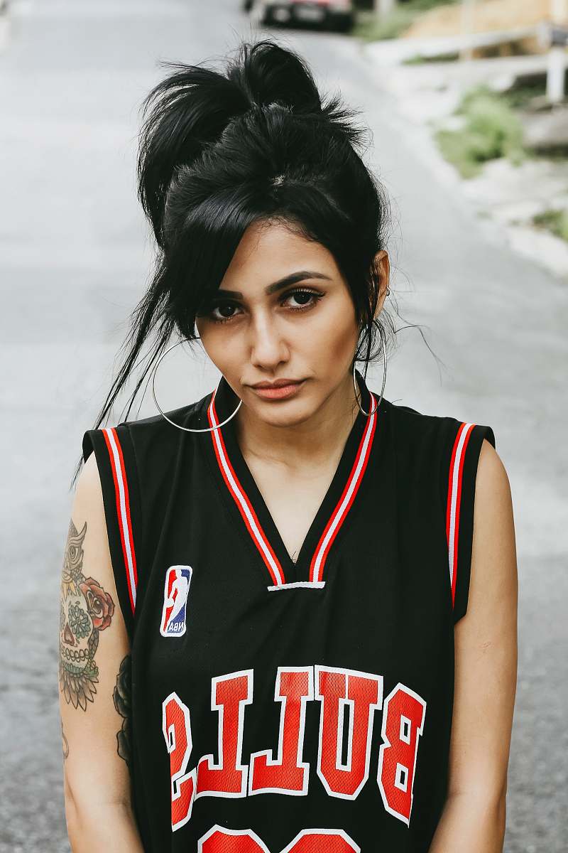girl woman in black Bulls jersey top woman