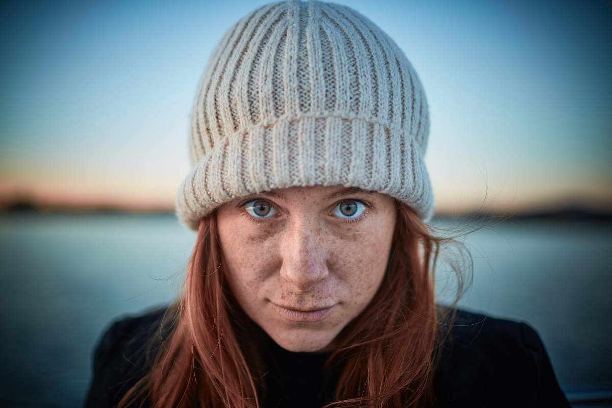 beanie woman wearing grey hat while selfie hat