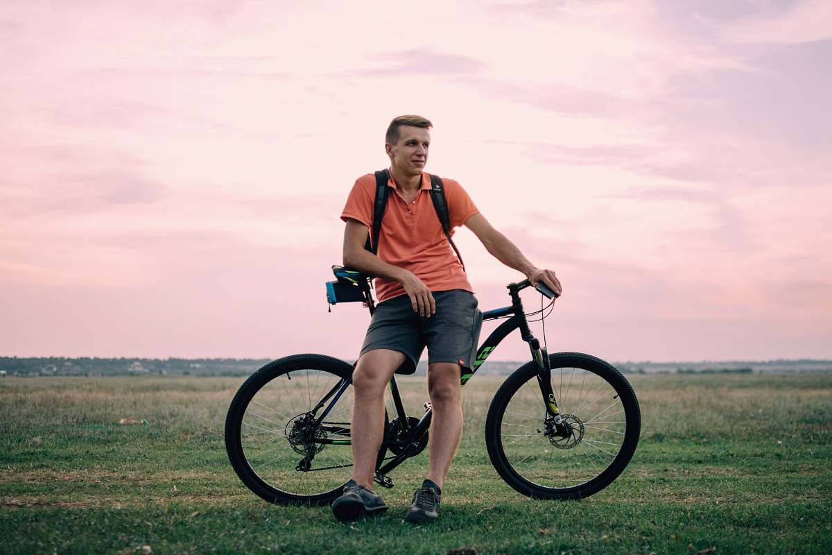 bike man sitting on hardtail bike under golden hour bicycle