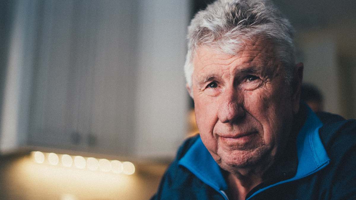 human man wearing brown jacket people