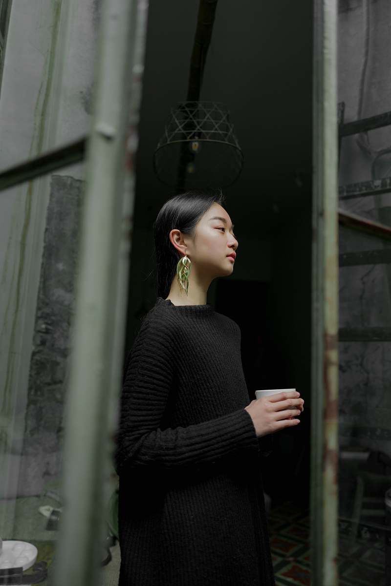 people man wearing corduroy top near wall human