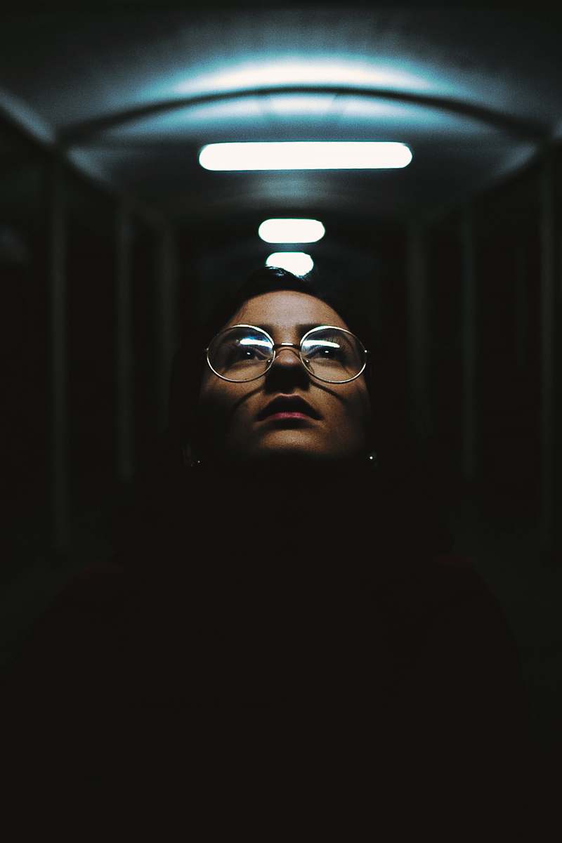 portrait shallow focus photography of woman in clear eyeglases with silver frames face