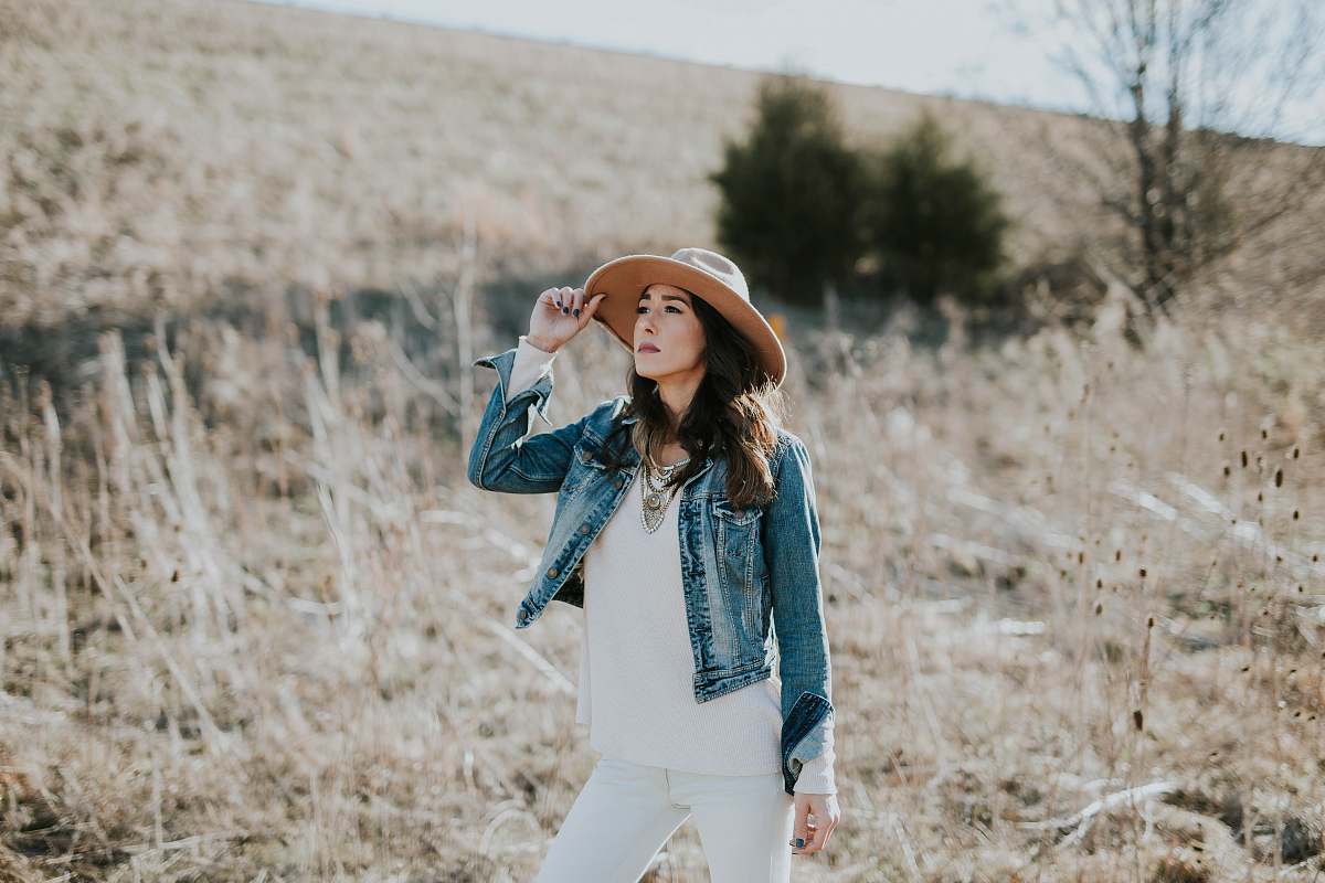 People Woman Holding Her Hat On Grass Field Woman Image Free Photo