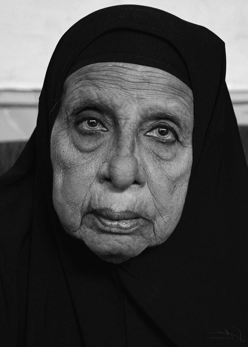 human woman in black hijab black-and-white