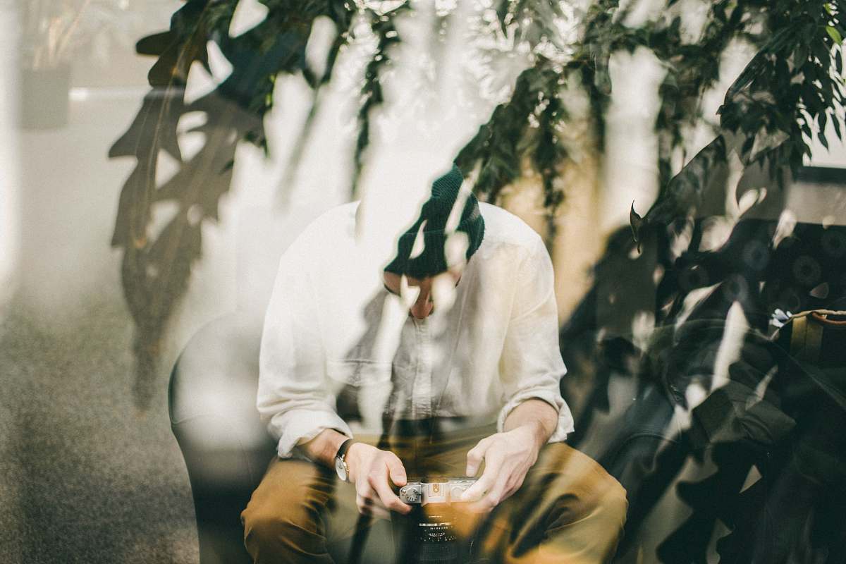 edmonton man sitting on chair using camera canada