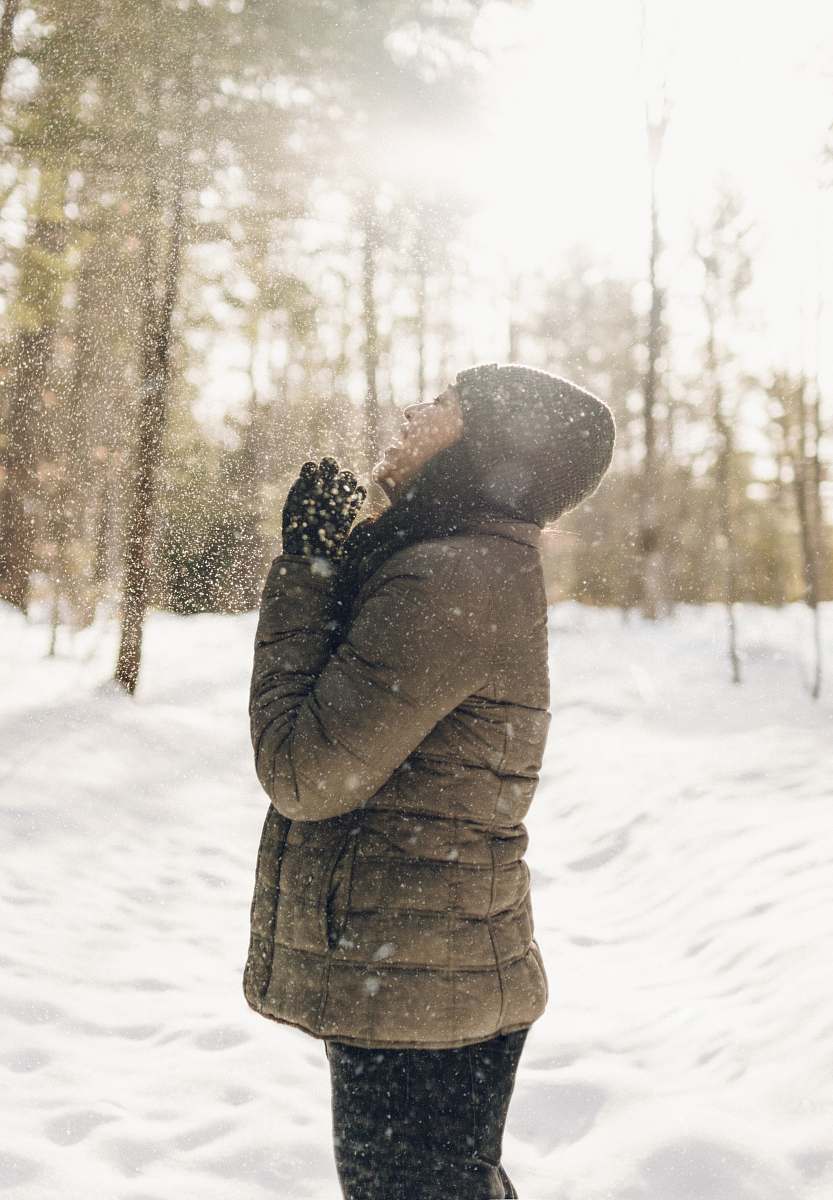 snow woman standing on snow field blizzard