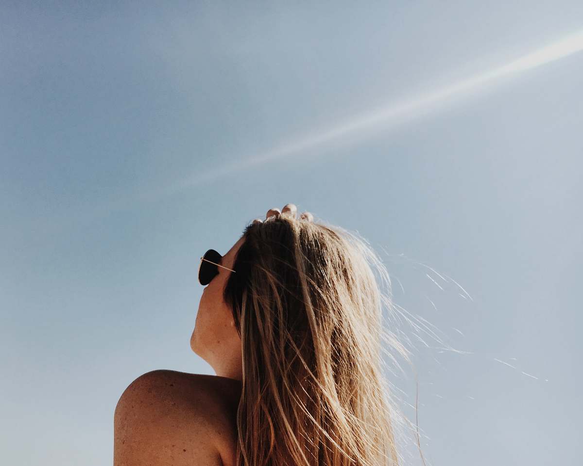 girl woman wearing gold framed Aviator sunglasses sunshine