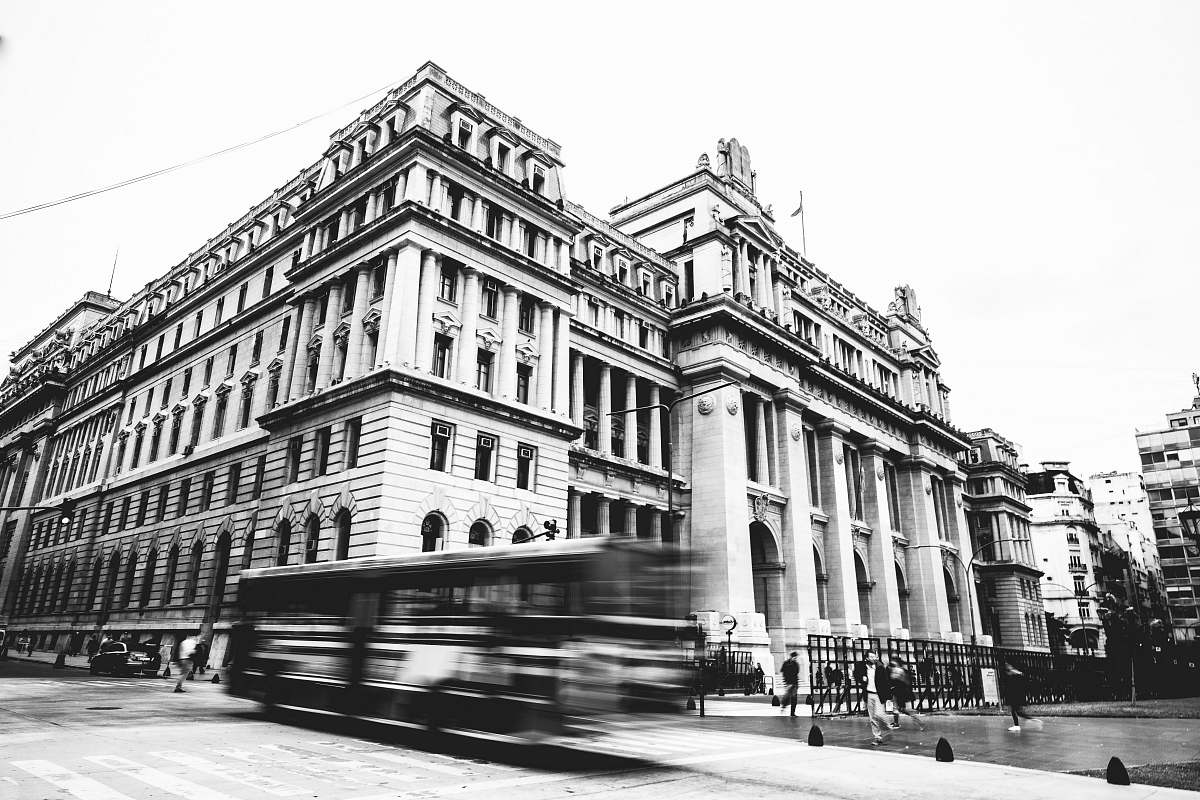 city greyscale photo of building human