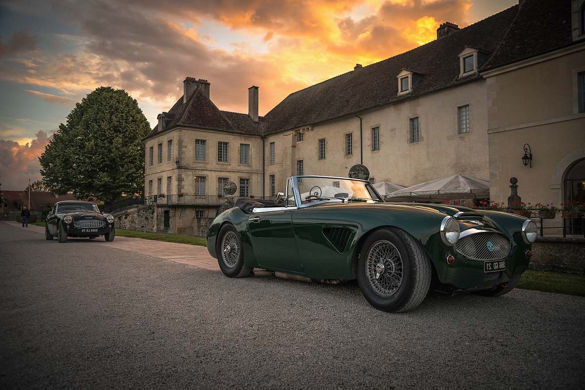 vehicle classic green convertible coupe near building automobile
