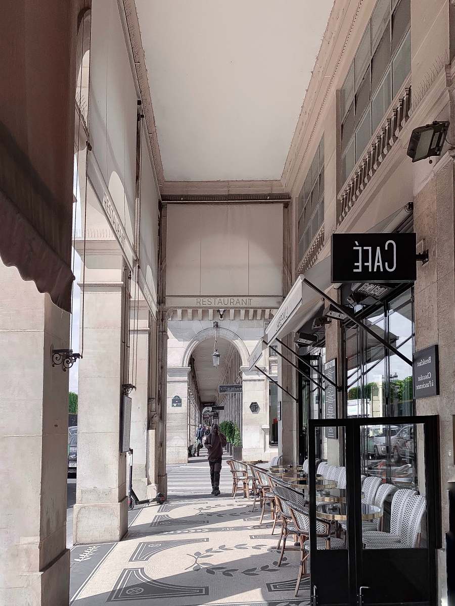 person man walking beside cafe human