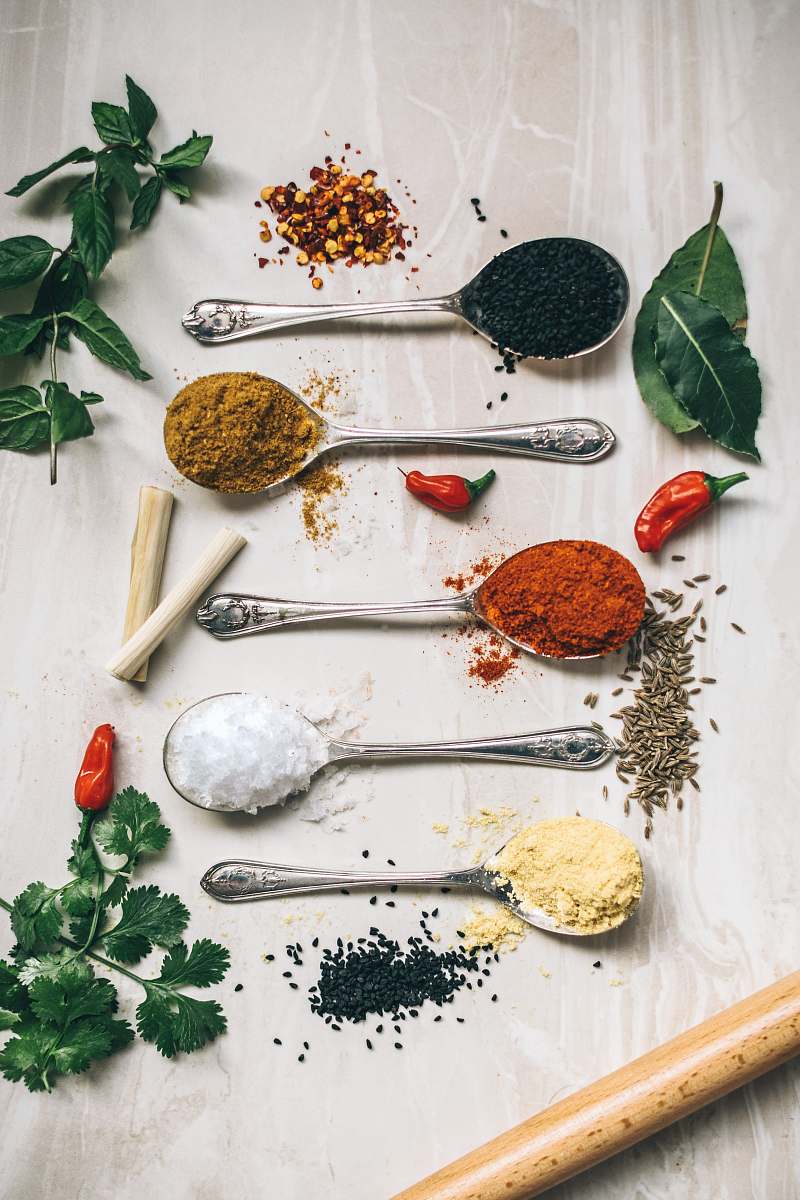 herbs five gray spoons filled with assorted-color powders near chilli spice