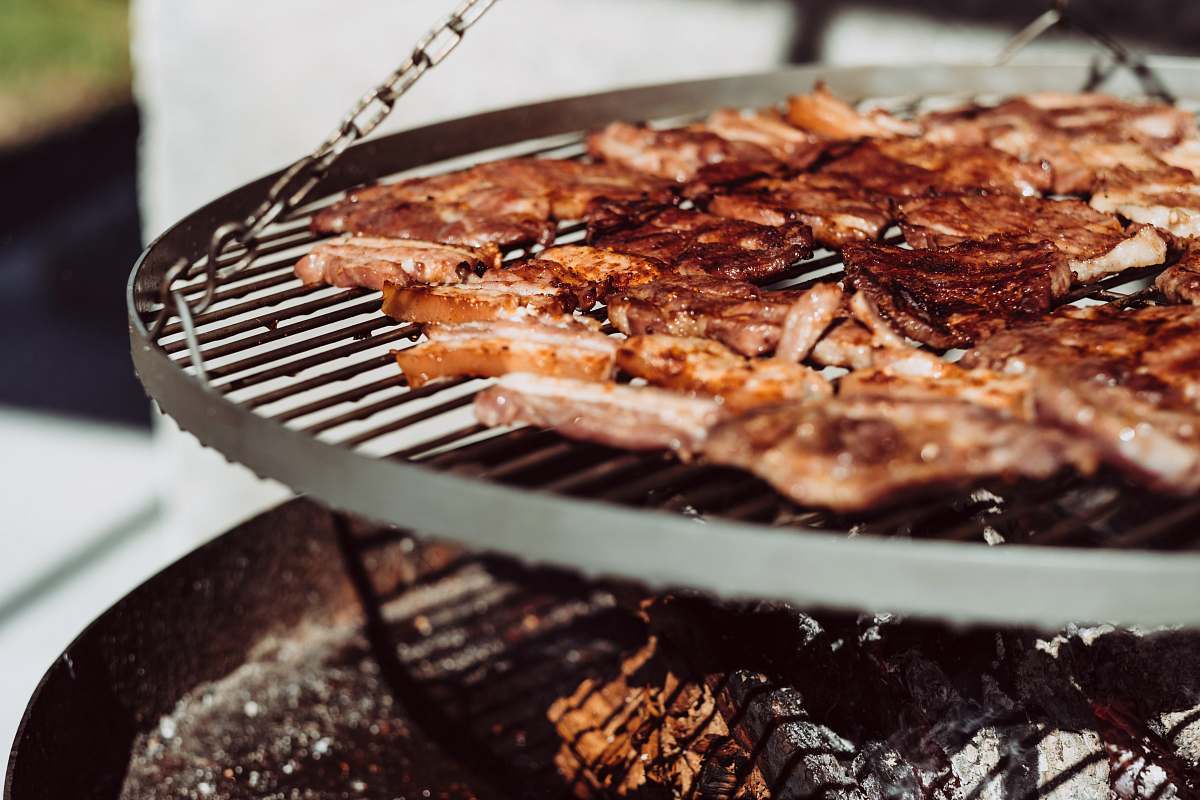 bbq grilled meat on hanging grill basket grain