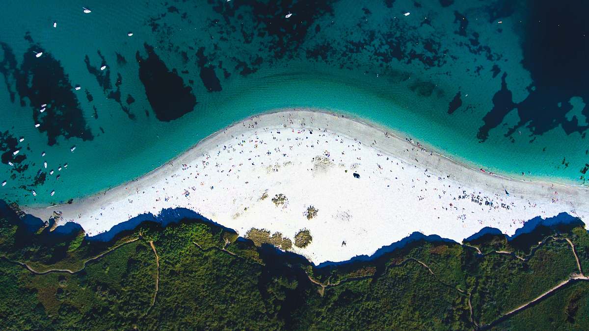 groix aerial photo of coastline near trees at daytime sea