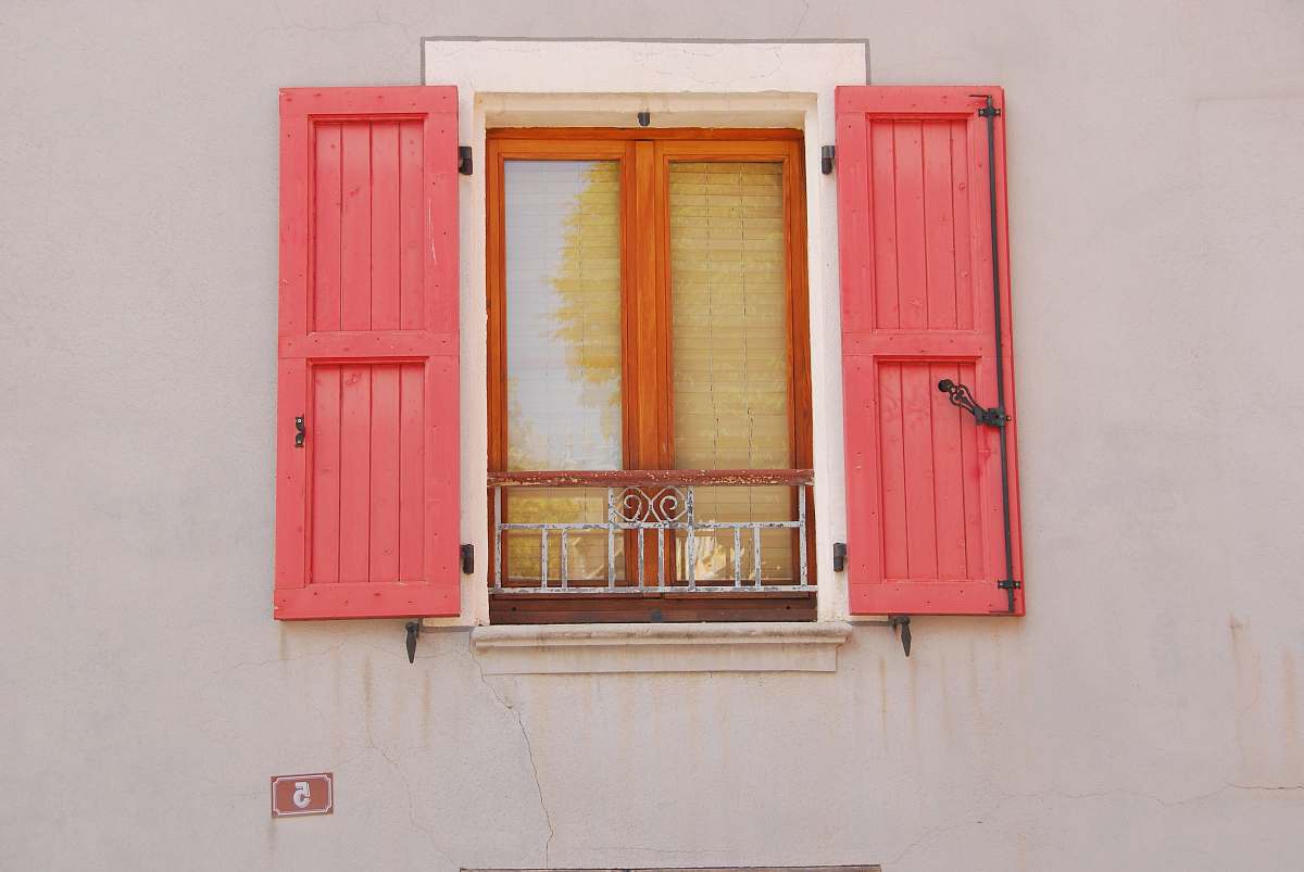 window opened red wooden window doors shutters