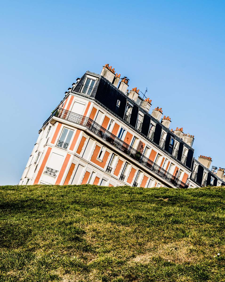 building white and orange concrete building paris