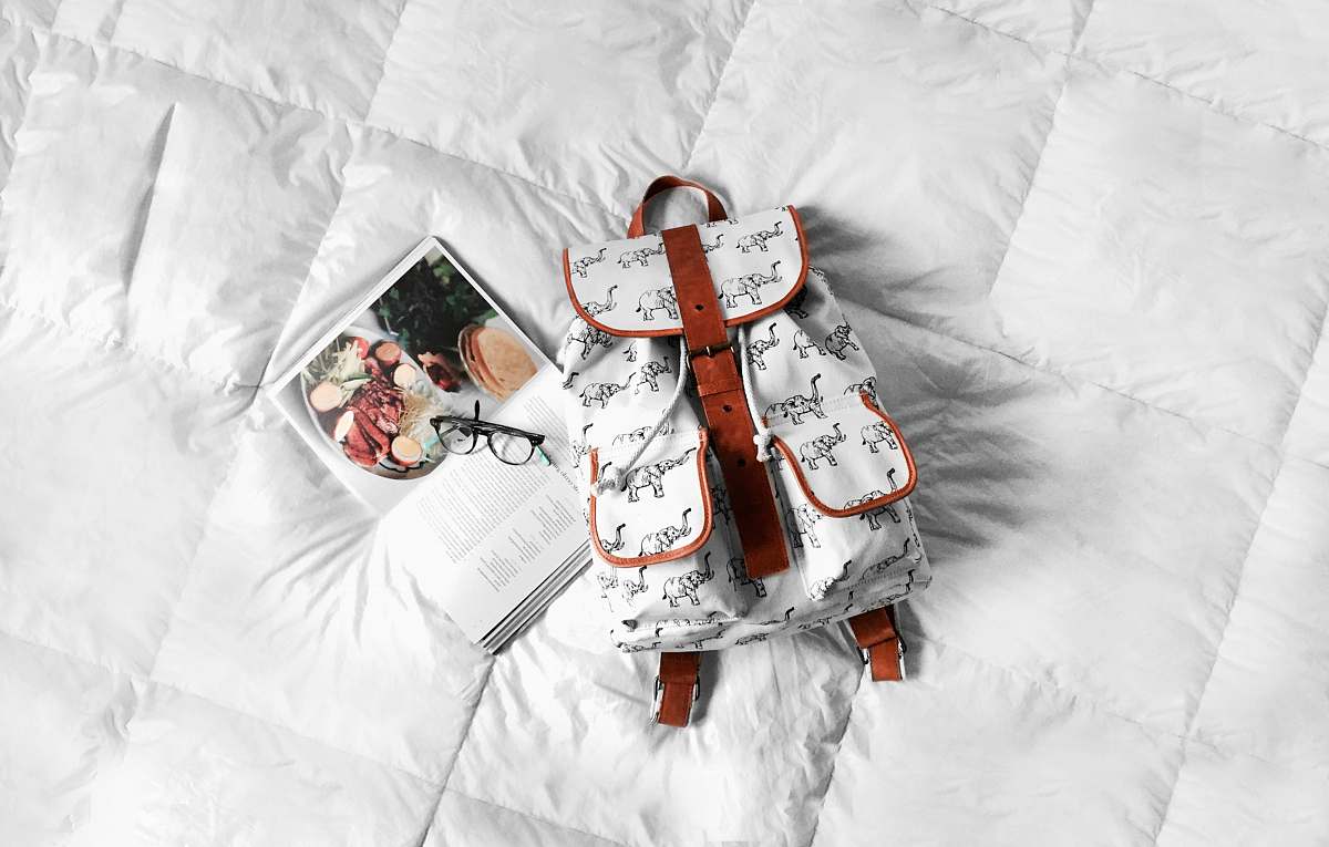 leather white and brown leather bag on bed buenos aires