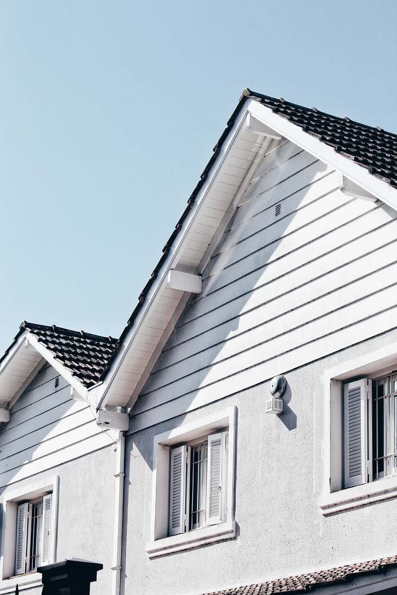 window wooden house during day roof