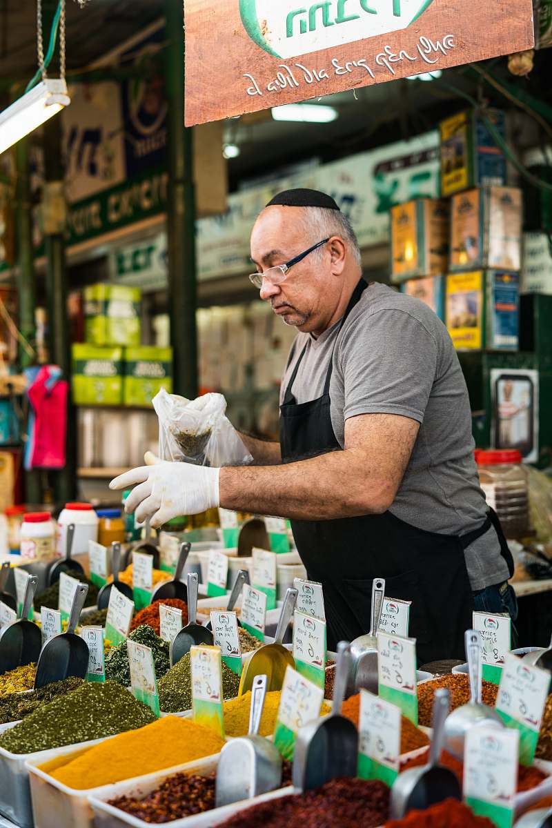 person man selling assorted seeds people