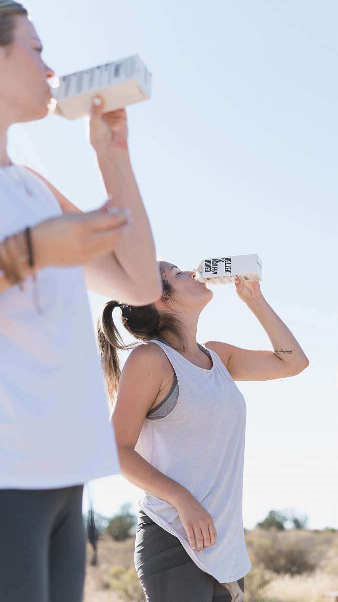 apparel Two women working out and drinking Boxed Water clothing