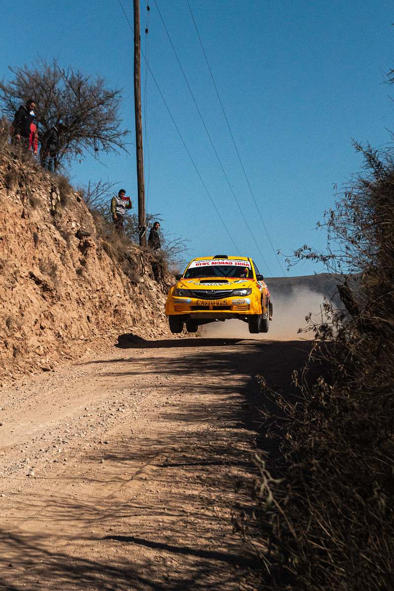 person yellow rally car on road car