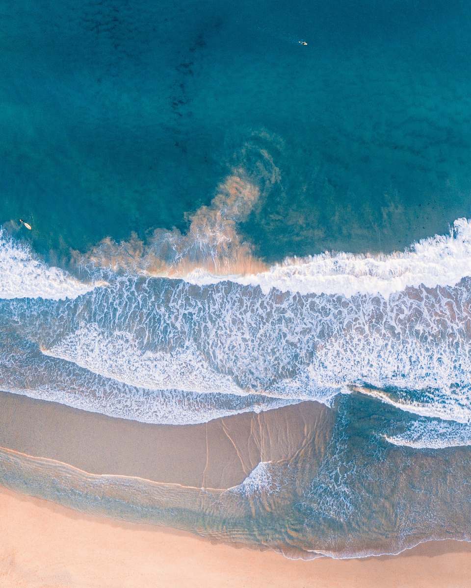 water high-angle photography of beach shore ocean