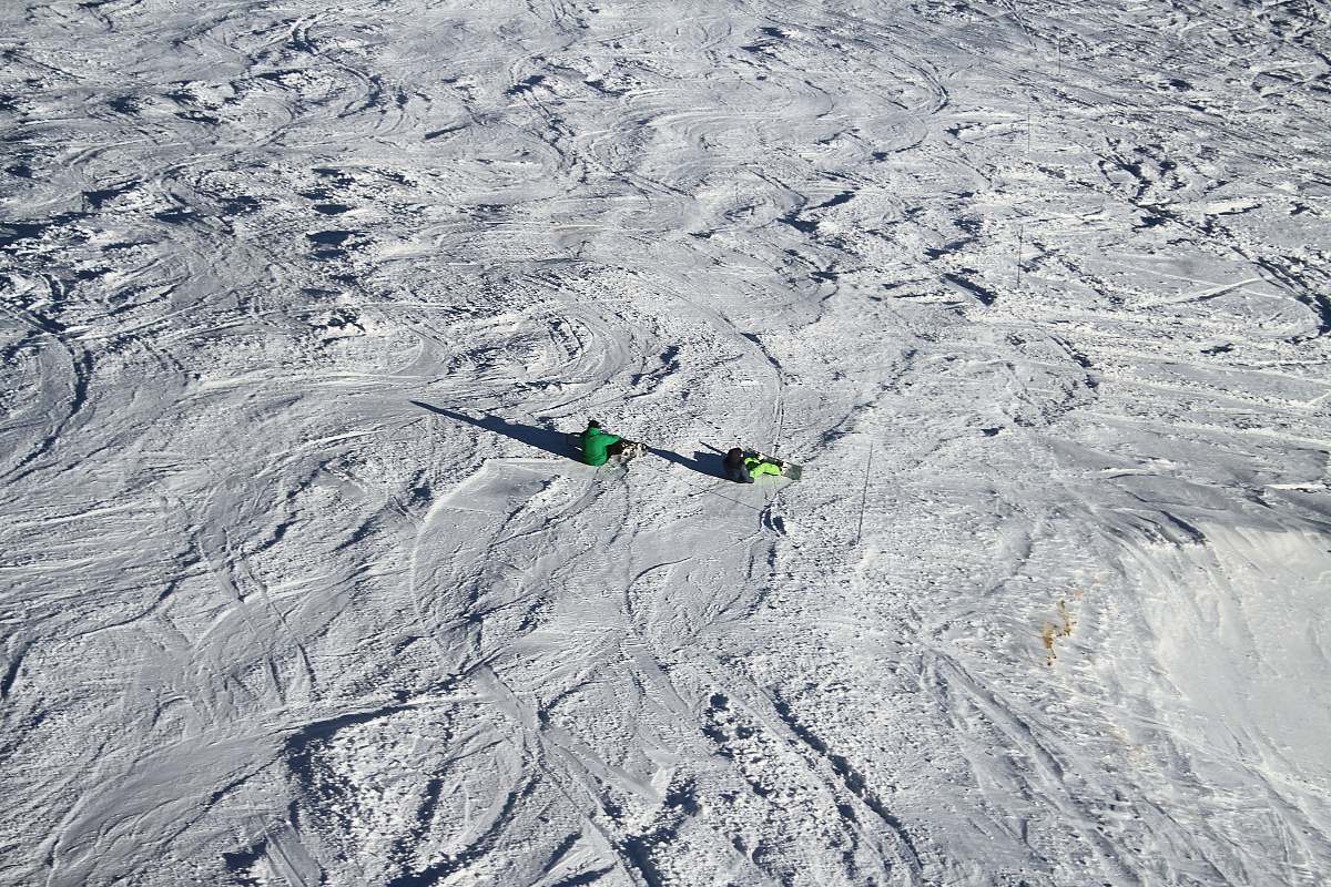 outdoors person sitting on snow covered field mountain