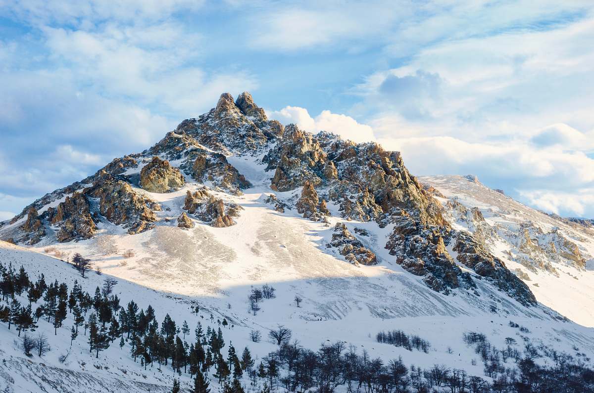 nature snow covered rock mountain view during day time mountain