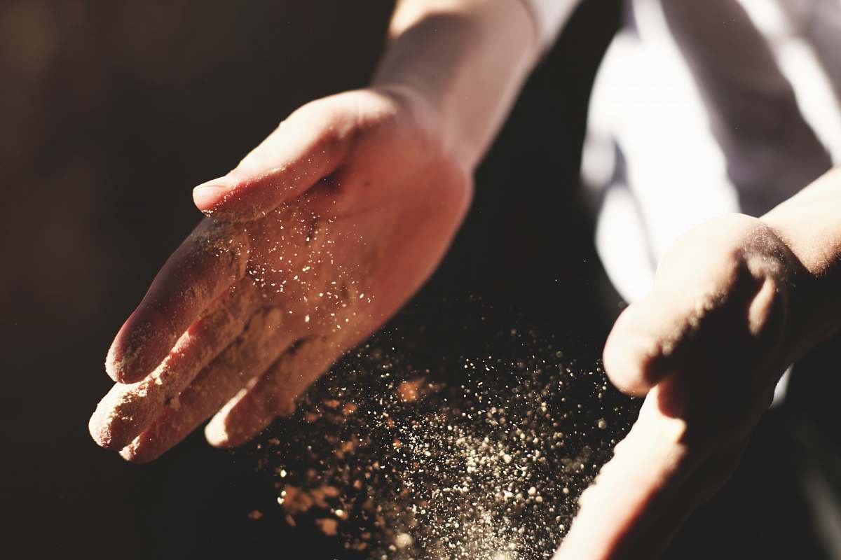 person person's hand with dust during daytime human