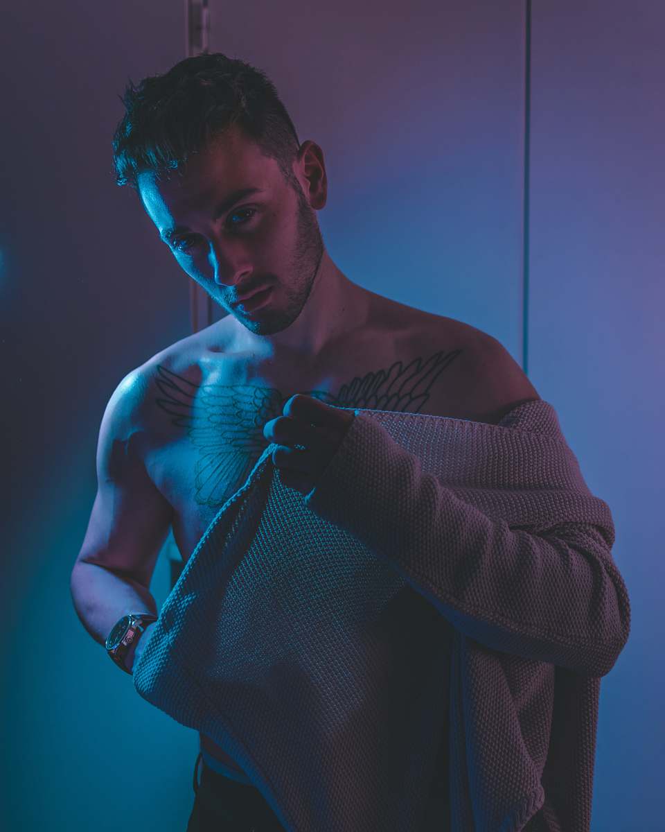 human man putting on sweater people
