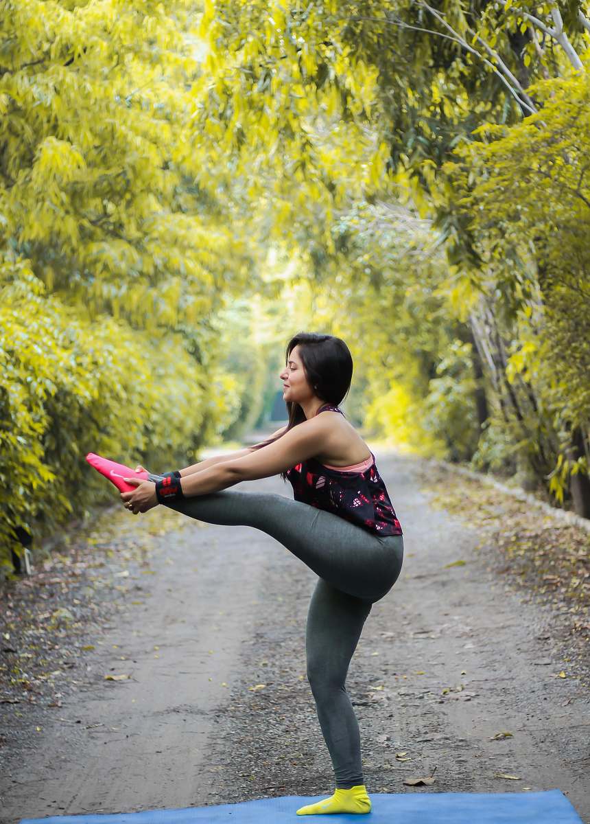 Human Woman Grabbing Her Foot Fitness Image Free Photo
