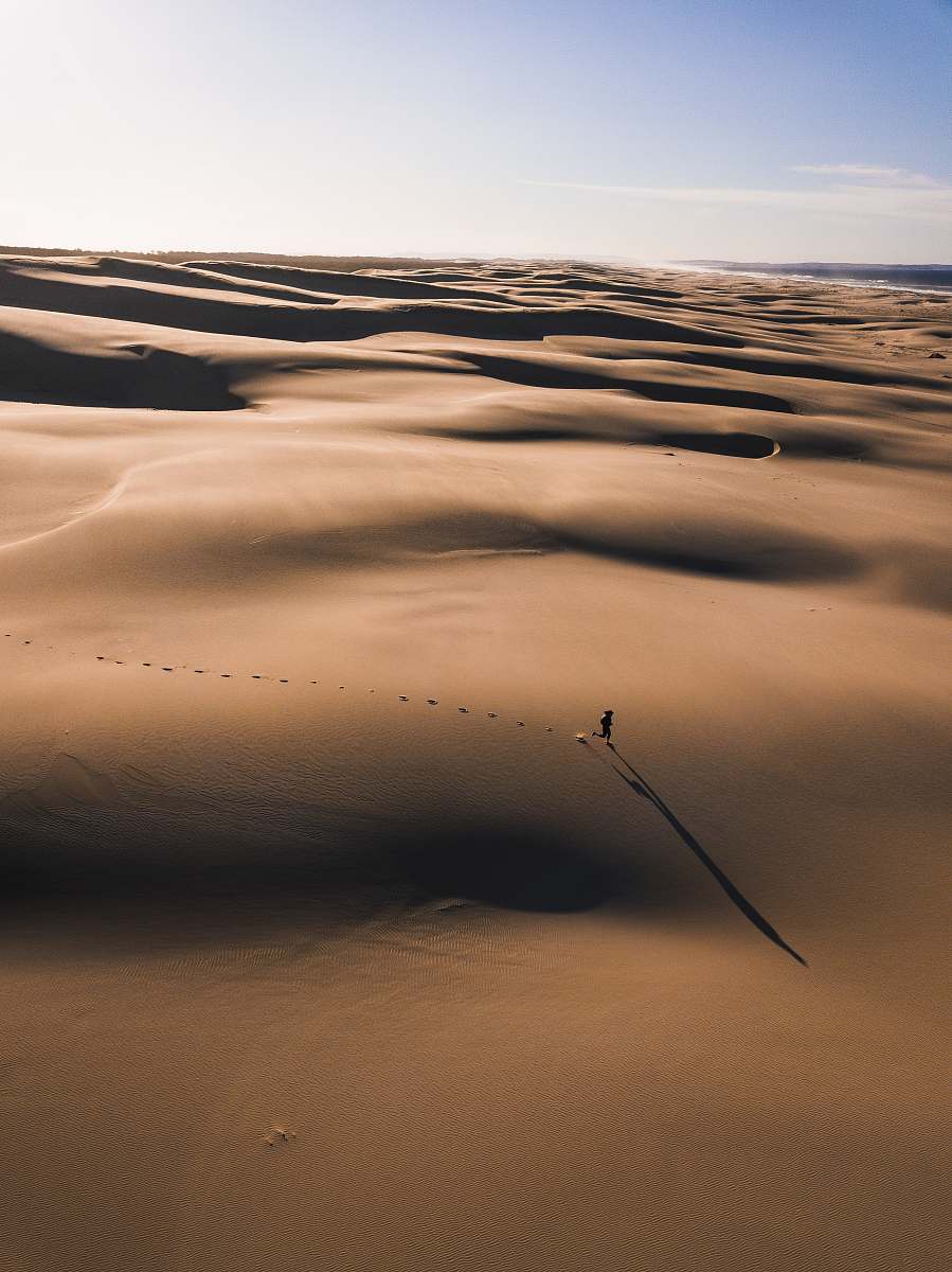 nature person walking on the desert photography sand