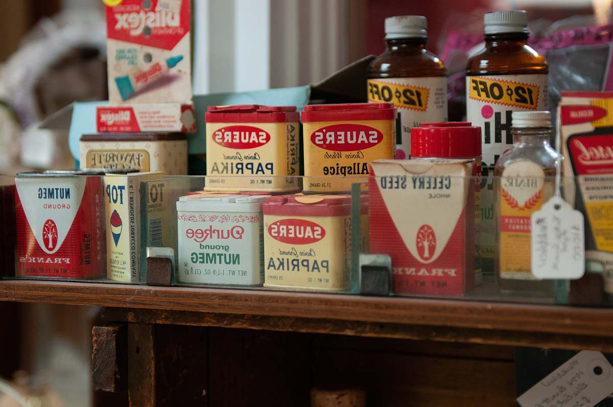 bottle Sauer's products on table herb