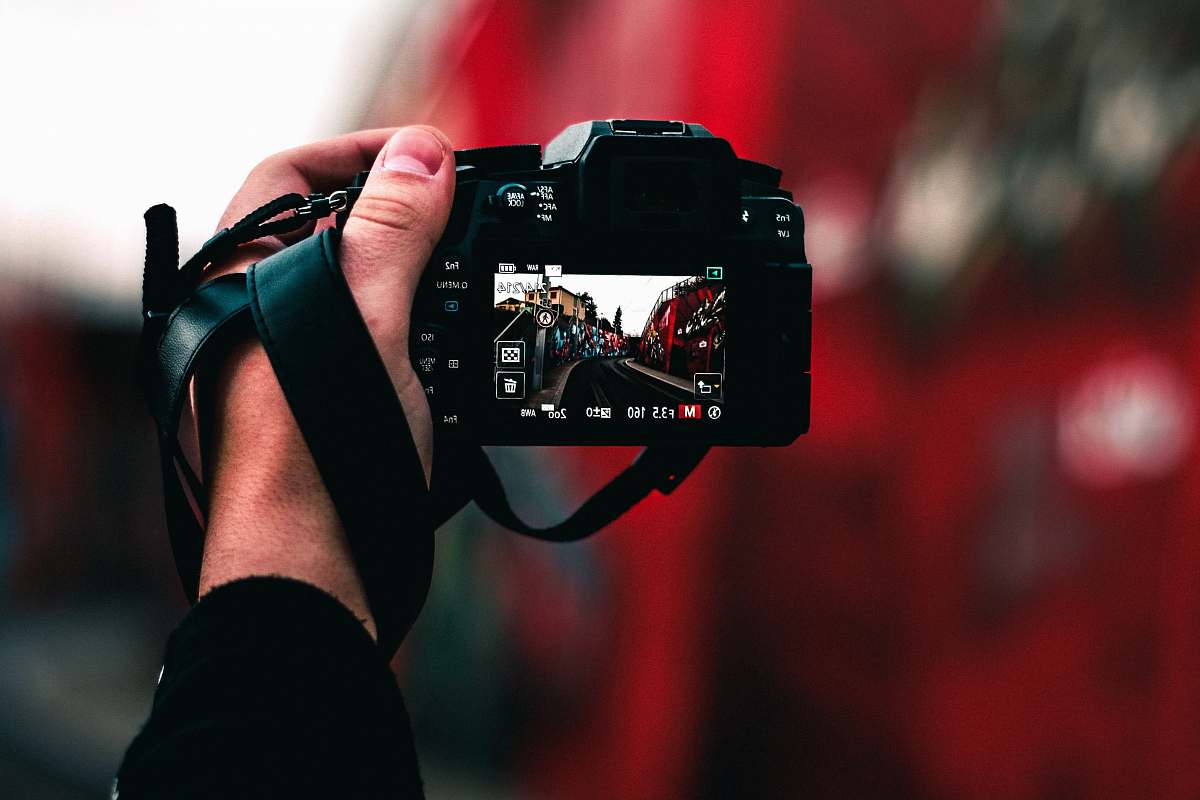 france black DSLR camera capturing road camera