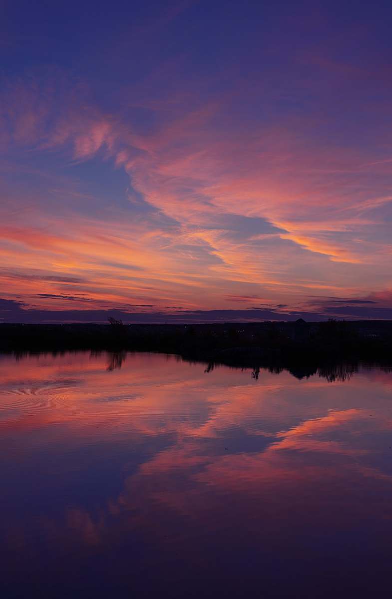 nature orange clouds reflection on clear blue water outdoors