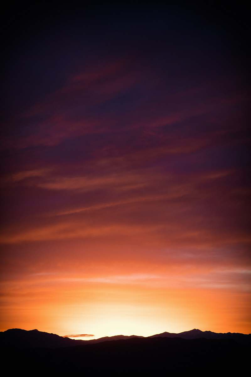 sky silhouette of mountains during orange sunset sunrise