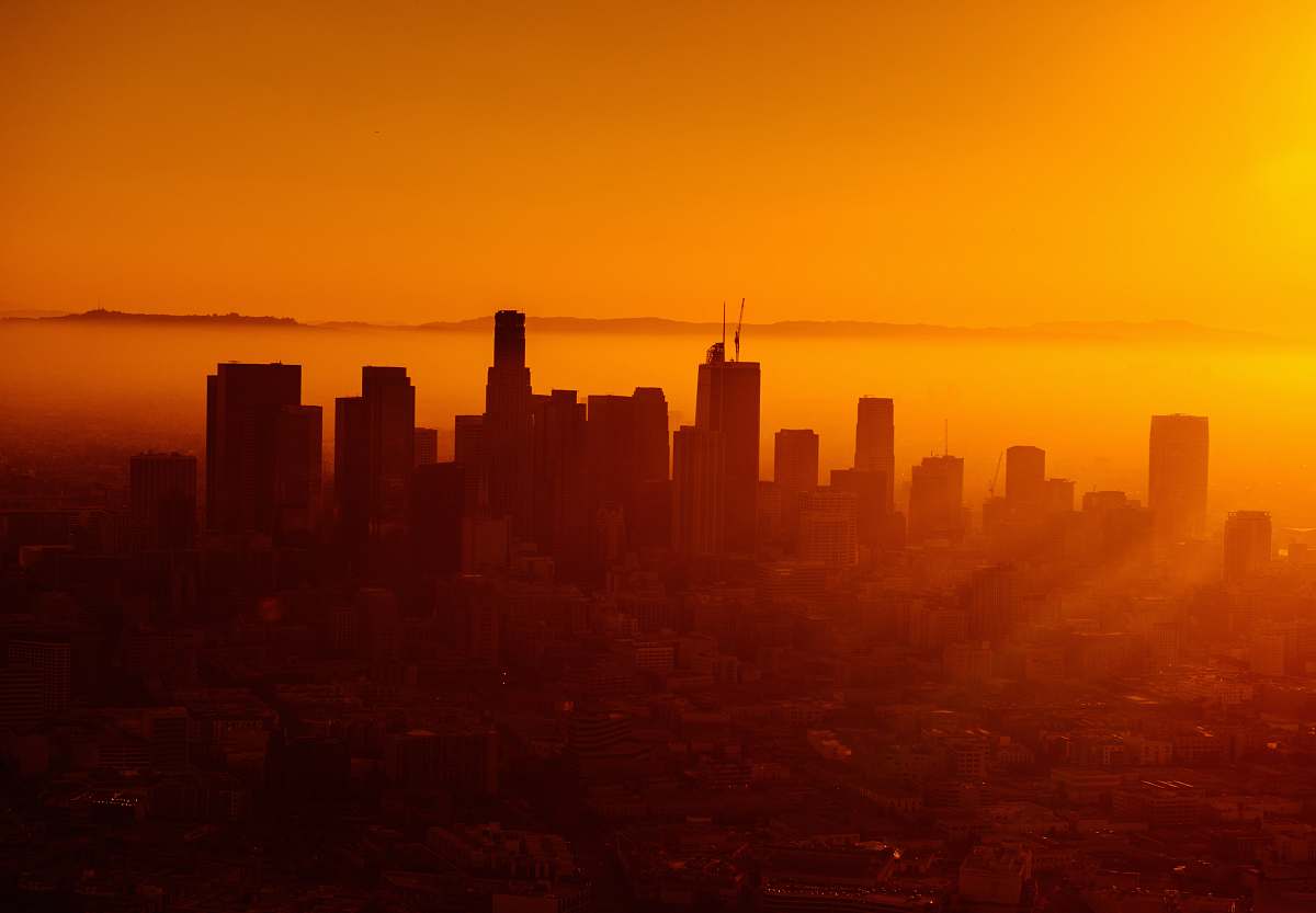 city silhouette photo of city skyline dawn
