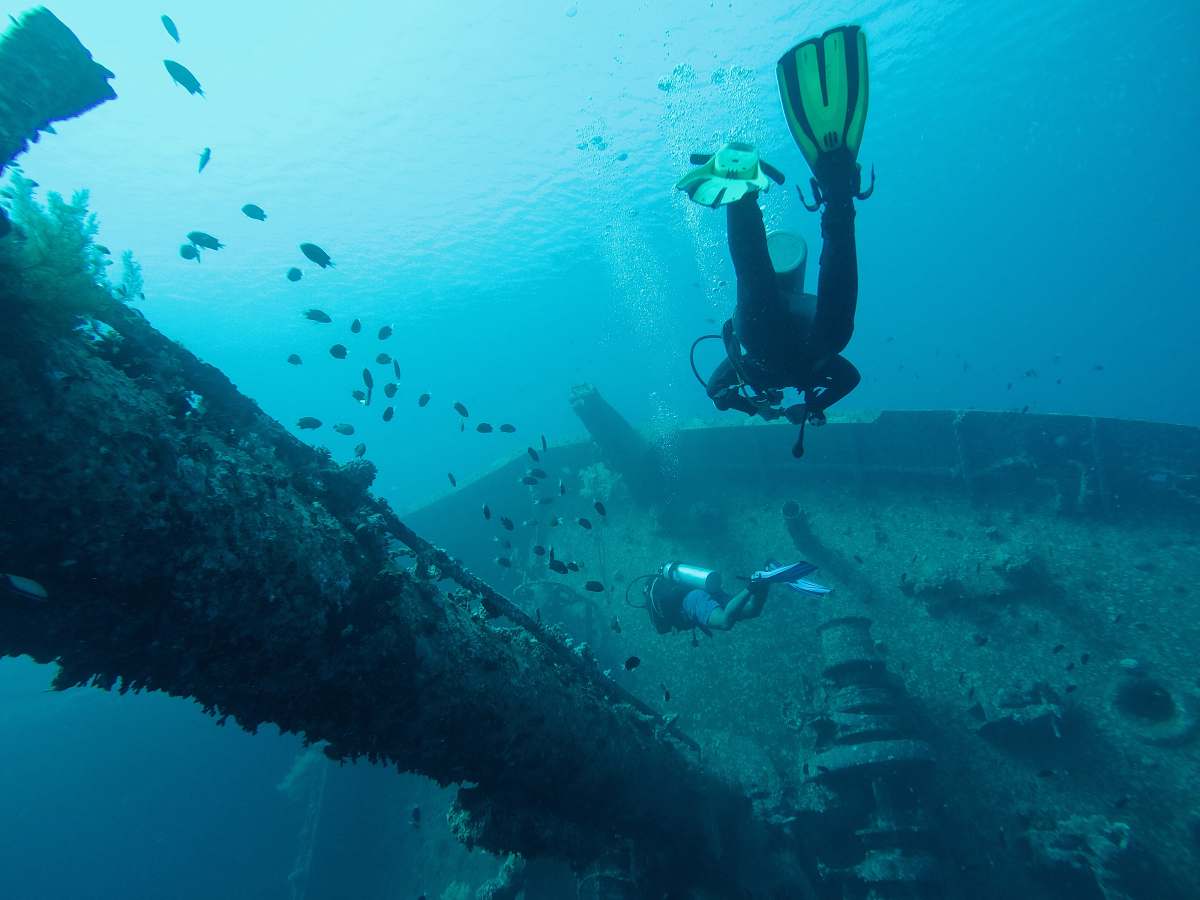 diving man wearing scuba diving swimming in water human